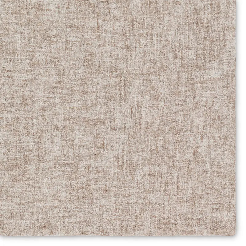 Textured beige carpet with a subtle pattern