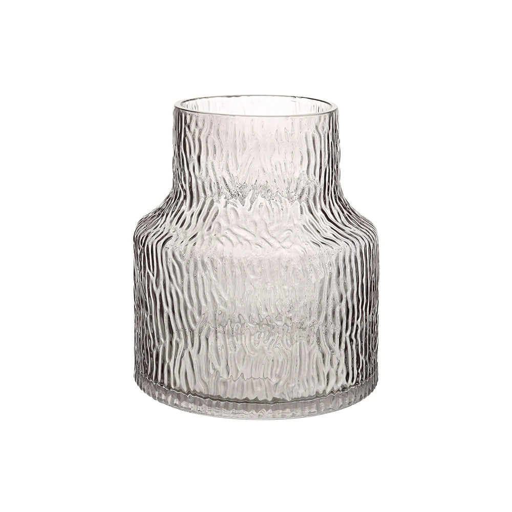 Clear glass vase with textured surface on a white background