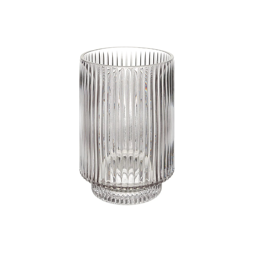 Clear glass vase with ribbed design on a white background
