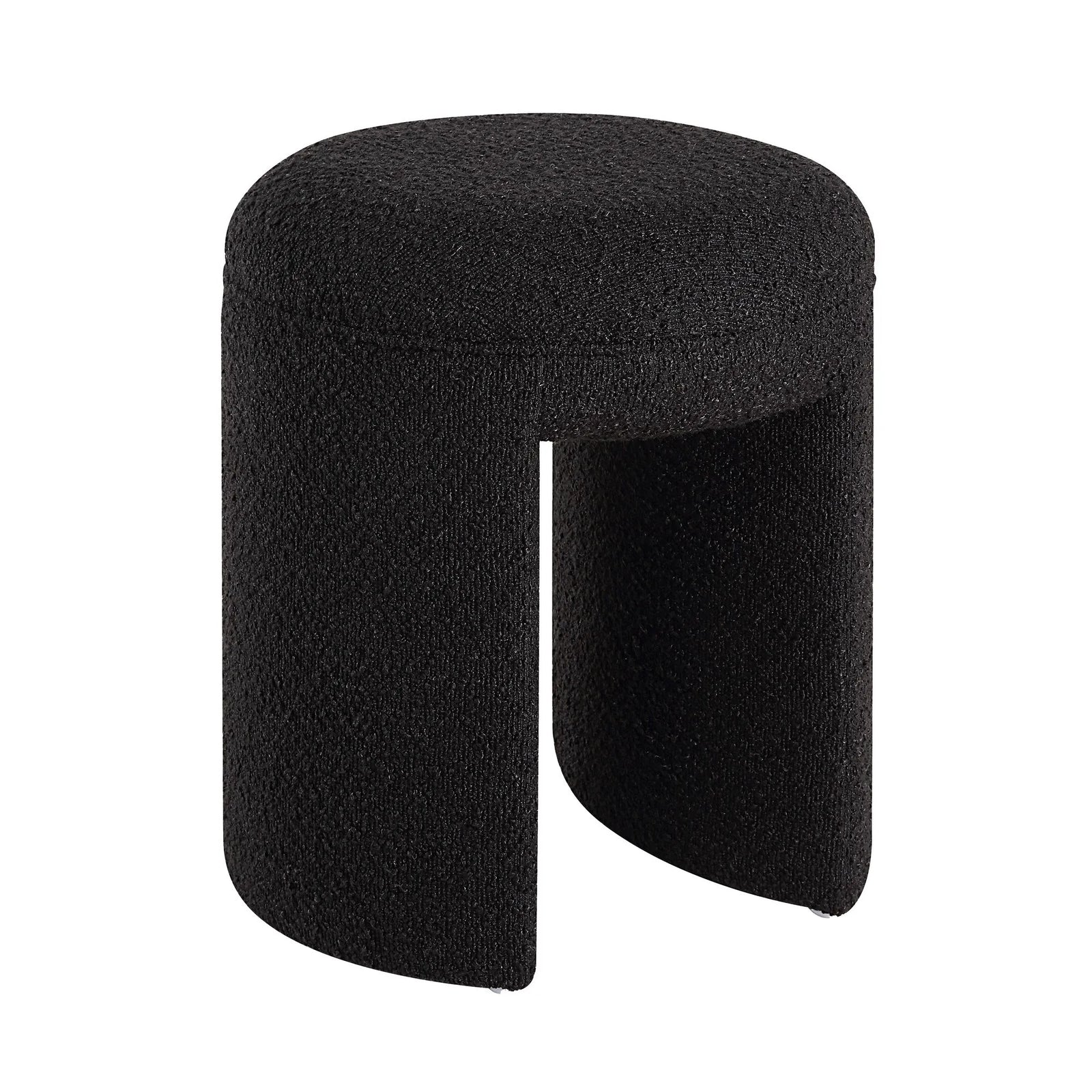 A black upholstered ottoman stool with a cylindrical shape and a visible seam running vertically in the center.