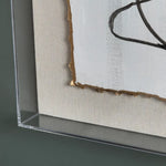 Two abstract wall art pieces with black line designs on a light background