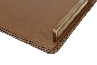 A leather tray with gold finished handle