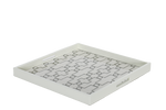 A white ivory serving tray with a geometric pattern.