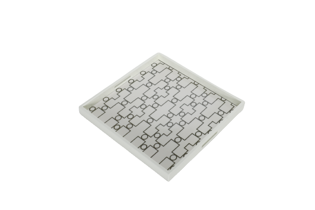 A white ivory serving tray with a geometric pattern.