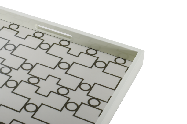 A white ivory serving tray with a geometric pattern.
