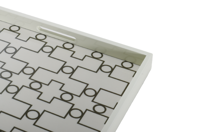 A white ivory serving tray with a geometric pattern.