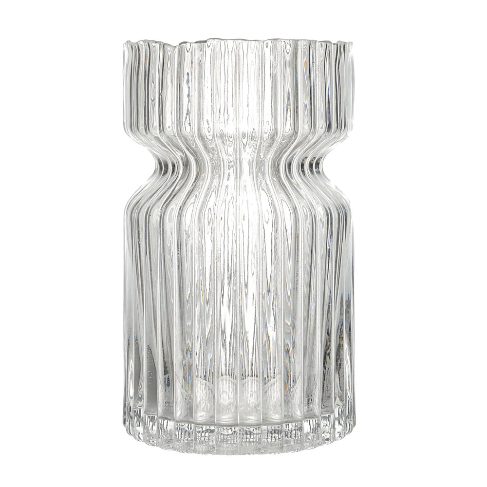 Clear glass vase with wavy design on a white background