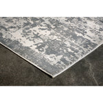 Gray patterned rug on a dark floor