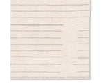 A rectangular beige area rug with a simple geometric pattern and power loomed construction.