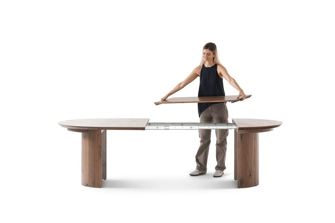 Woman holding a modern dining table on a white background