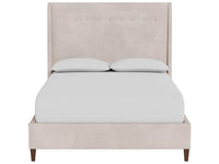 A light beige upholstered bed frame with a tall wingback headboard and matching footboard, shown with white bedding and two white pillows on a plain white background.