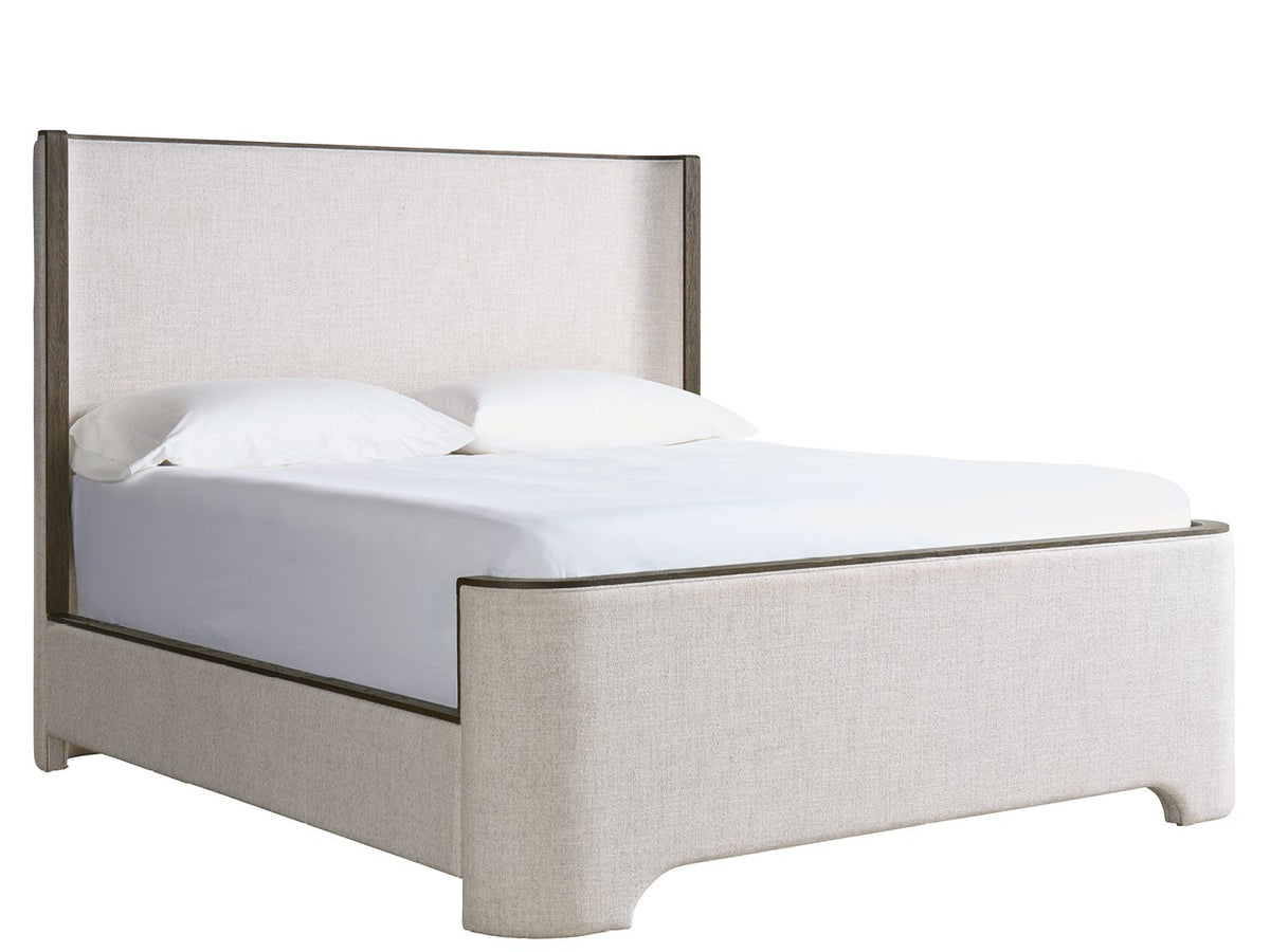Beige upholstered bed with white bedding on a white background