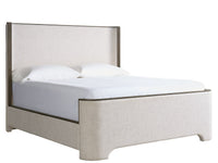 Beige upholstered bed with white bedding on a white background