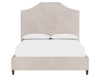 Beige upholstered bed with white bedding on a white background