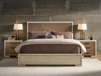 Modern bedroom with a bed, nightstands, and lamps against a textured wall.
