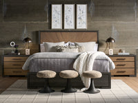 Modern bedroom with a wooden bed, side tables, and decorative elements.