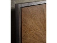 Close-up of a wooden panel with a dark brown finish and visible wood grain texture.