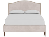 An upholstered bed frame with a tall arched headboard and matching footboard, shown with white bedding and two pillows on a plain white background.
