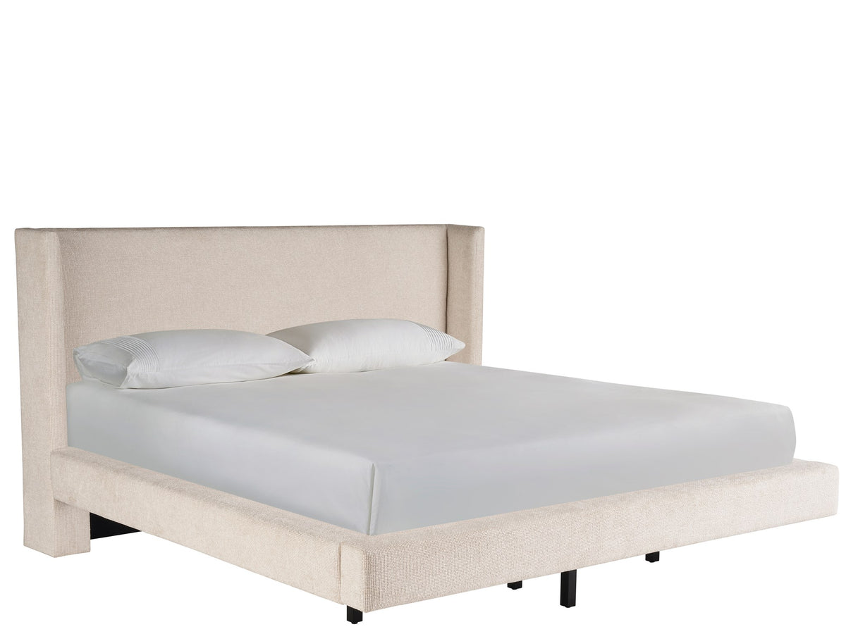 Beige upholstered bed with white bedding on a white background