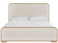 Beige upholstered bed with white bedding on a white background