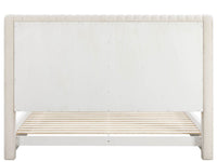 White wooden crib with slatted base on a white background