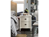 Bedroom with a nightstand, bed, and chair.