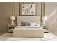 Beige bedroom set with bed, nightstands, and lamps against a brown wall with abstract art.