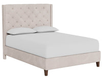 Beige upholstered bed with white bedding on a white background