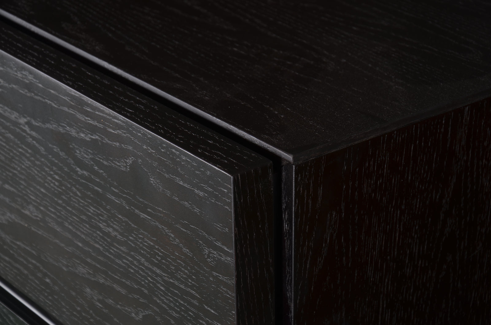 Black dresser with multiple drawers