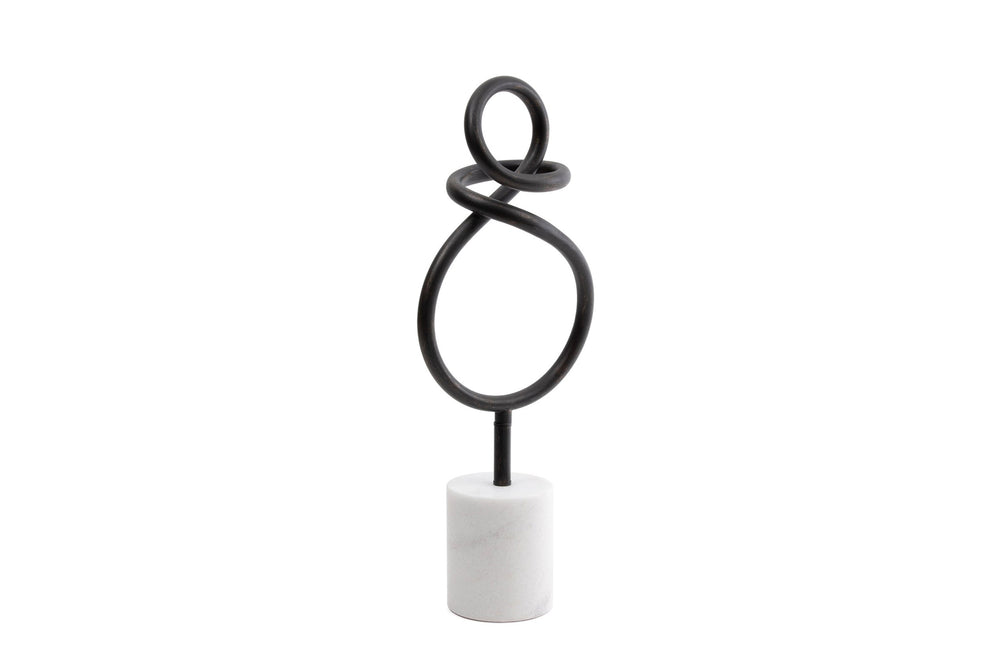 Decorative object with black spiral design on a white background