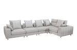 A gray modular sectional sofa with multiple seats and cushions, designed for large seating areas.