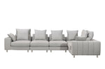 A gray modular sectional sofa with multiple seats and cushions, designed for large seating areas.