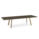 A rectangular dining table with a dark wood top and brass accent legs.