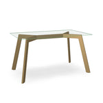 Amy Glass Dining Table
A clear glass top dining table with a brass accent base.