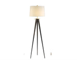 A modern style floor lamp with a black tripod base and a white lampshade, designed by Hoya Casa.