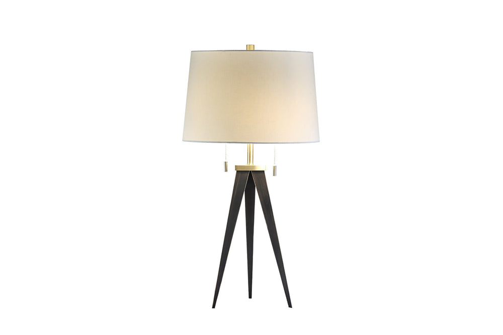 A modern table lamp with a white fabric shade, gold-colored metal base, and black adjustable legs.