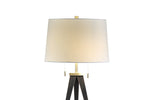 A modern table lamp with a white fabric shade, gold-colored metal base, and black adjustable legs.