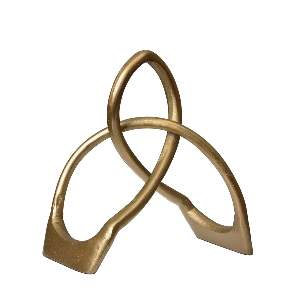 A gold-colored, brass bookend with a unique design, likely to be used as a decorative piece on a bookshelf.