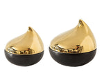 Two gold and black decorative jars with a teardrop shape on a white background