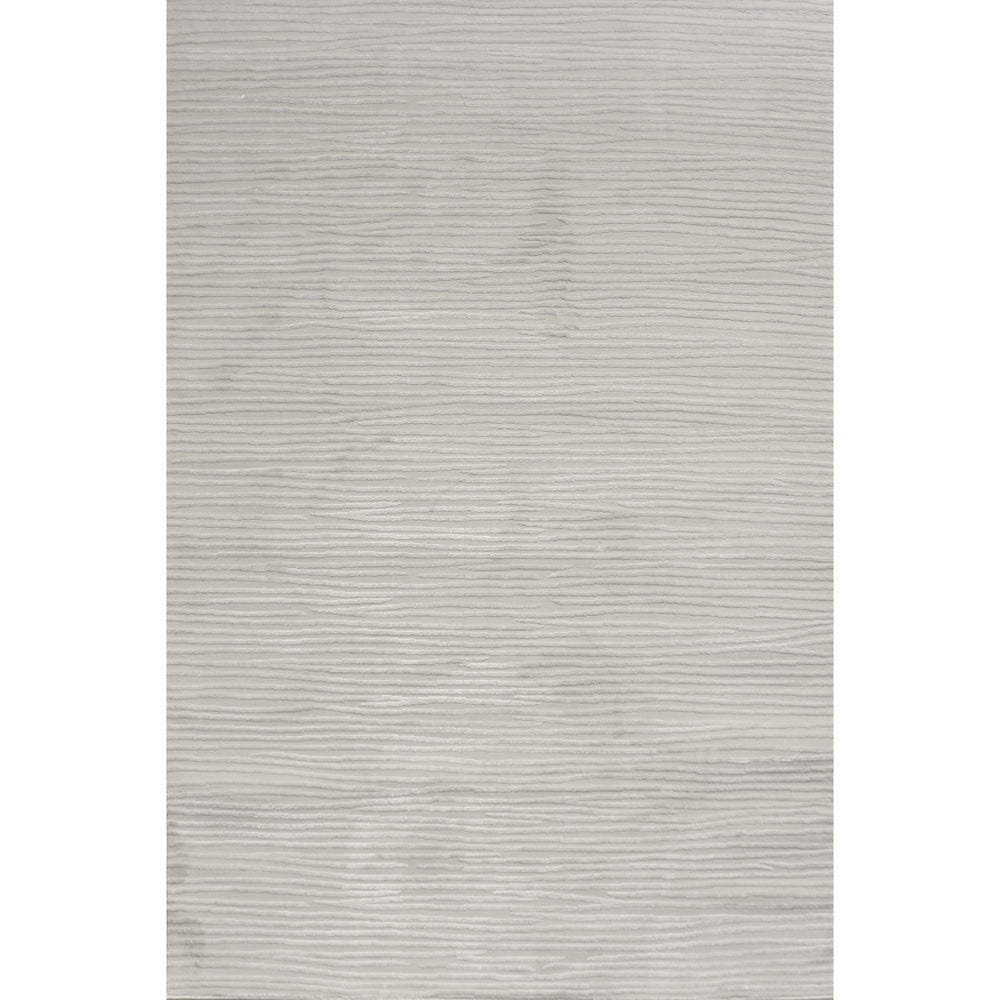 A power loomed area rug in light cream and grey colors with a polypropylene pile and jute backing.