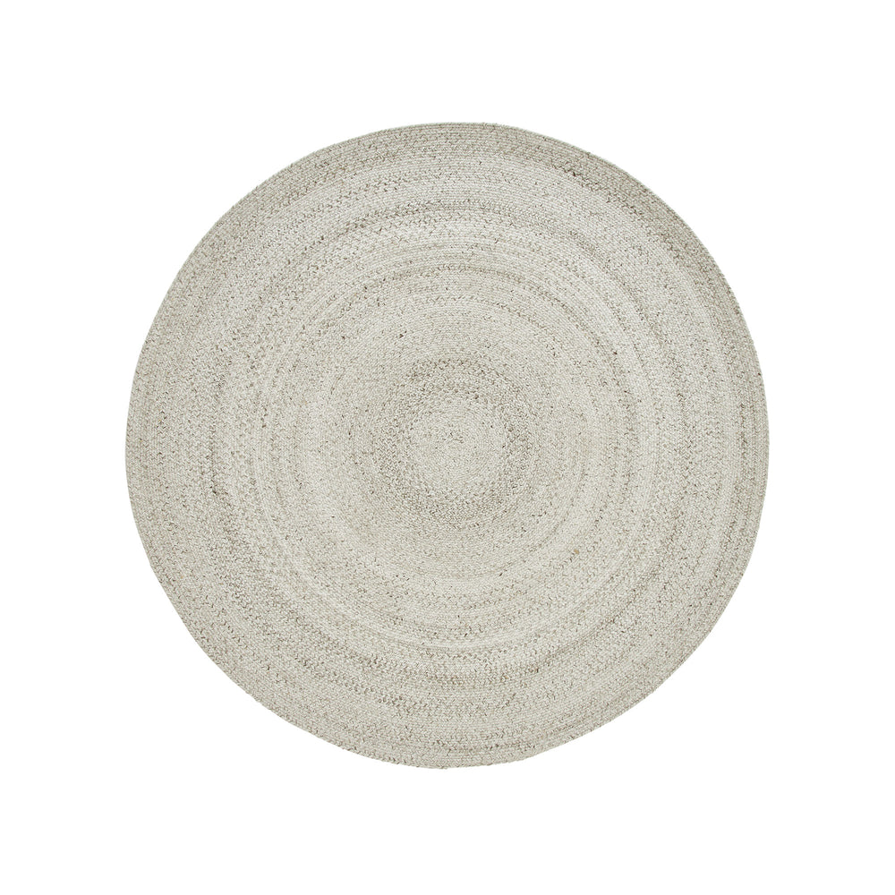 A round, beige area rug with a swirling geometric design