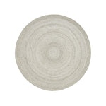 A round, beige area rug with a swirling geometric design
