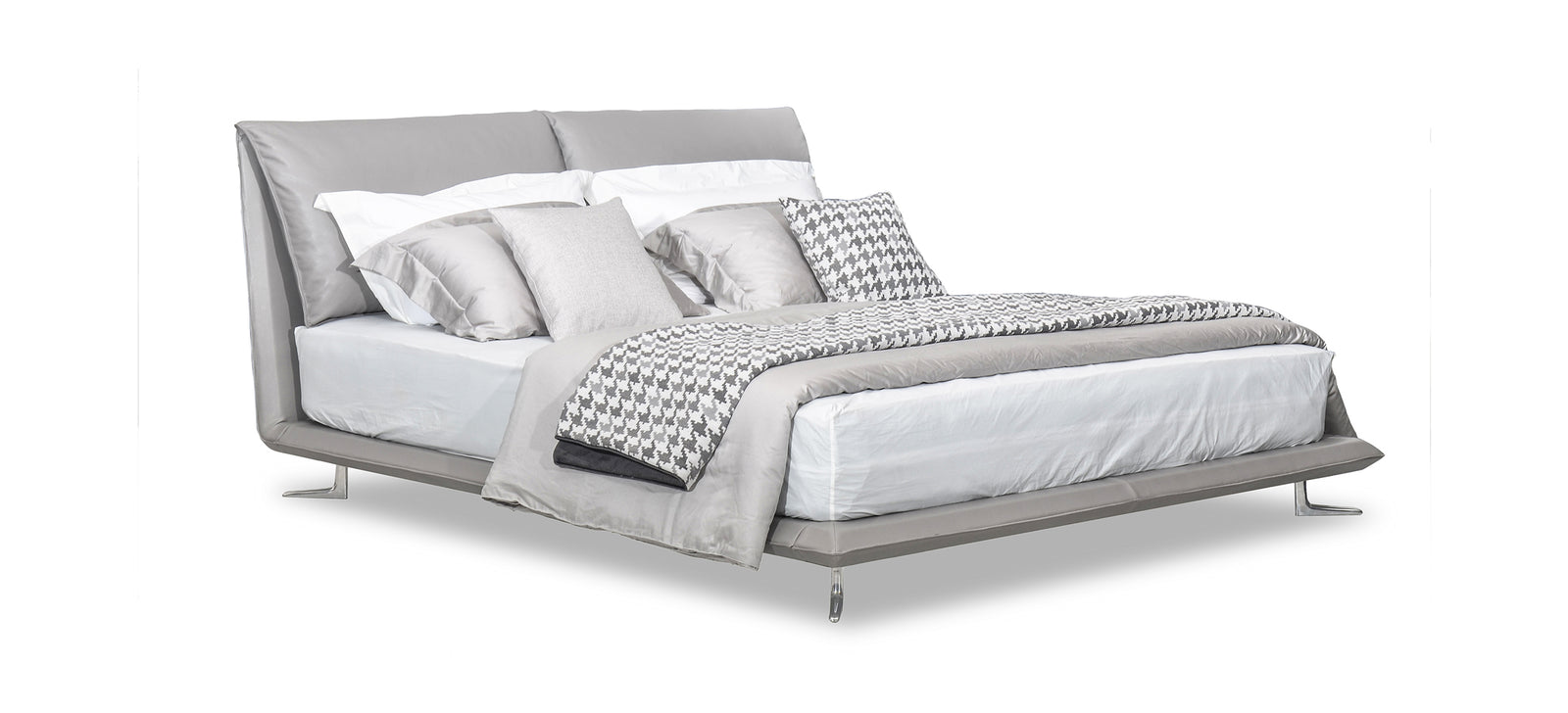 A luxurious king-sized bed with gray upholstery, featuring a headboard, bed frame, and bed slat. Pillows are on the bed, adding to its elegance.