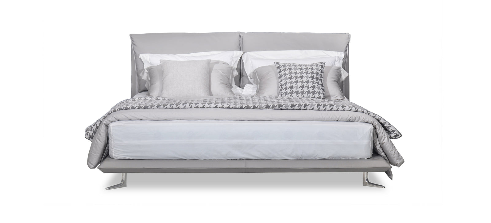 A luxurious king-sized bed with gray upholstery, featuring a headboard, bed frame, and bed slat. Pillows are on the bed, adding to its elegance.