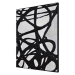 Hand painted black and white abstract design on canvas with a black frame.