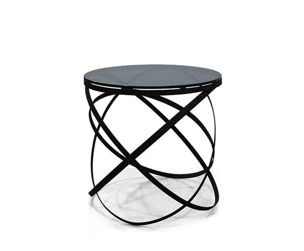 Modern side table with black circular top and base on a white background