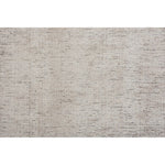 A light beige, solid pattern area rug.