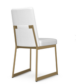 A white dining chair with a upholstered backrest and seat, featuring a gold-colored metal frame.
