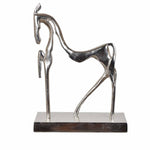 Silver horse sculpture on a white background