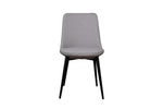 A gray upholstered dining chair with slim black matte finish steel legs.